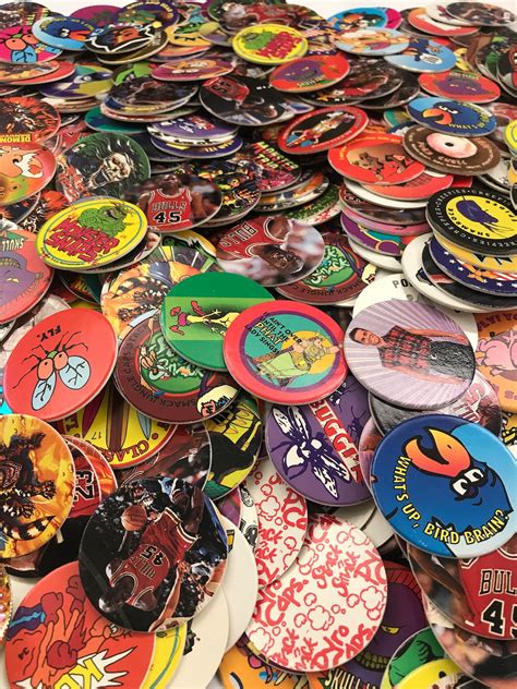 Pogs slammers - Buy it with. +. Total price: $38.98. Add both to Cart. These items are shipped from and sold by different sellers. Show details. This item: 200 POGS, 3 Slammers and 1 Game Board. $23.99. Pog Retro Kaps Neon Purple Storage Tube Starter Set Game Includes: 20 Pogs & 2 Exclusive Slammers. 